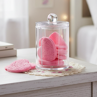 Glass jar with pink heart-shaped makeup remover spnges